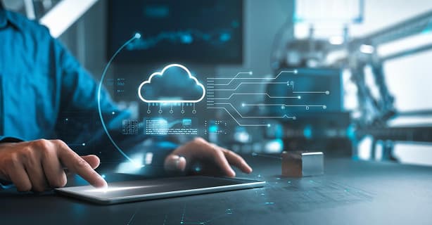Person using a tablet with a digital cloud and data‑node overlay, representing cloud‑based HR and payroll technology in SAP SuccessFactors.