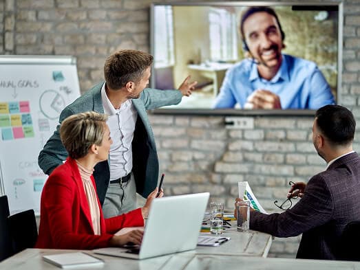 A group of people in a workshop meeting